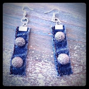 Denim earrings with sparkles on them.